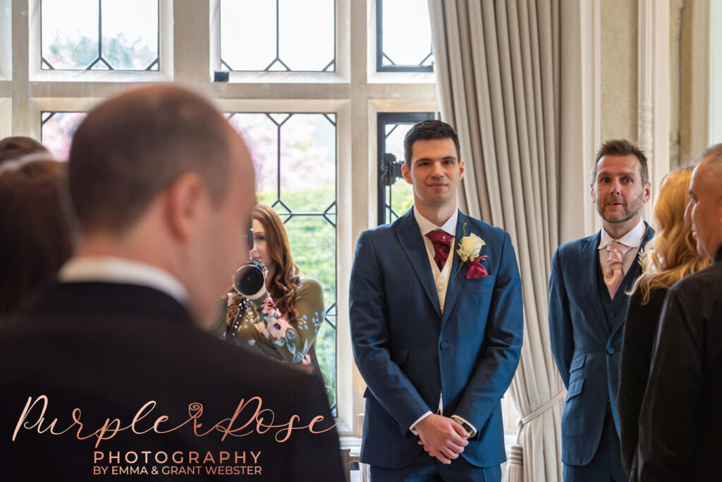 Photo of groom waiting f or his bride to arrive at their wedding ceremony in Milton Keynes