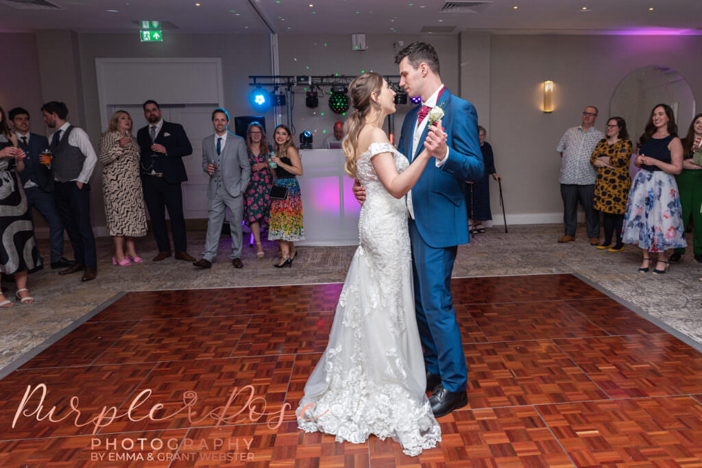 Photo of a bride and groom dancing on their wedding day