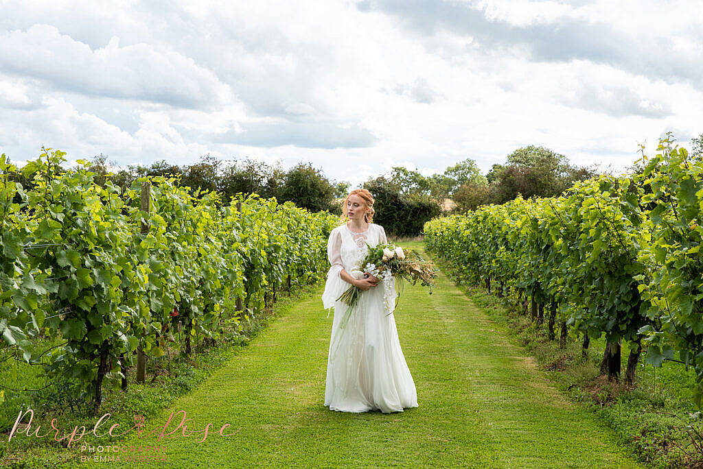 Bride walking with flowers