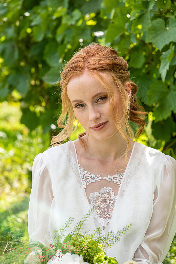 Bride sat in vineyard