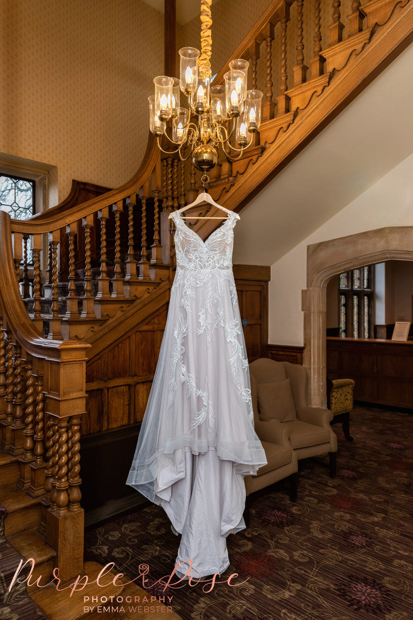 Wedding dress hanging from a chandelier