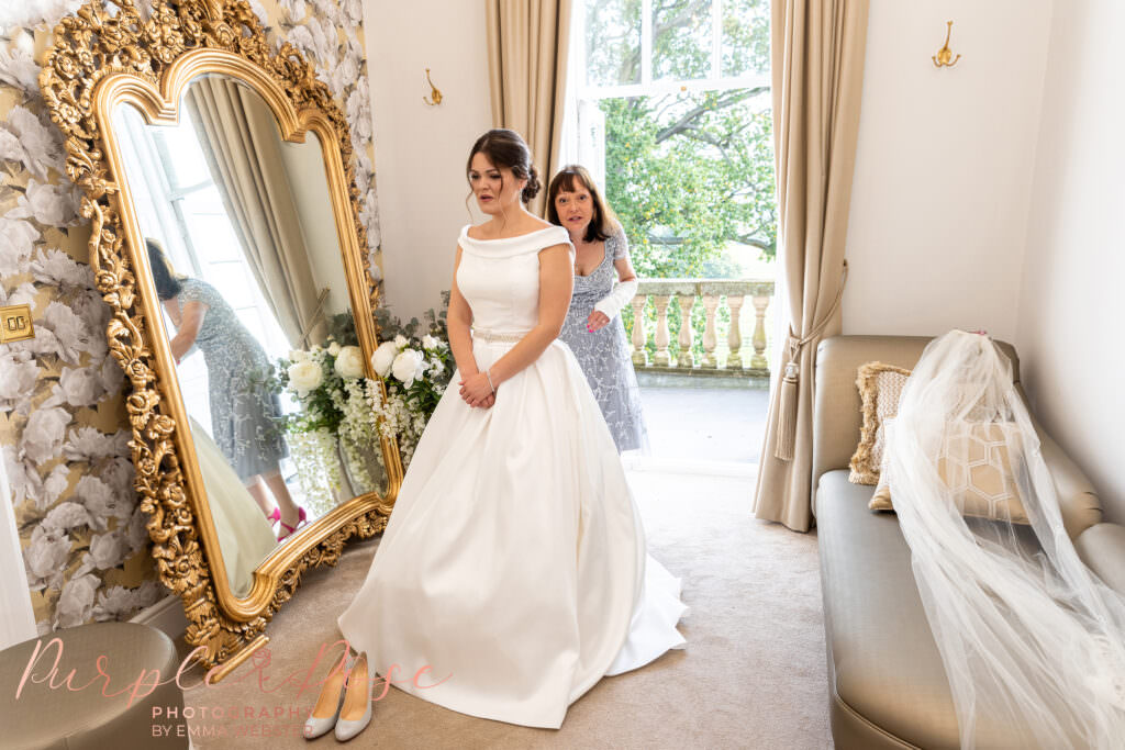 Bride with her mother getting ready at Bouton Hall