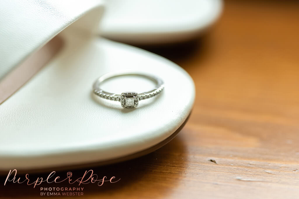 Engagement ring, placed on brides shoe