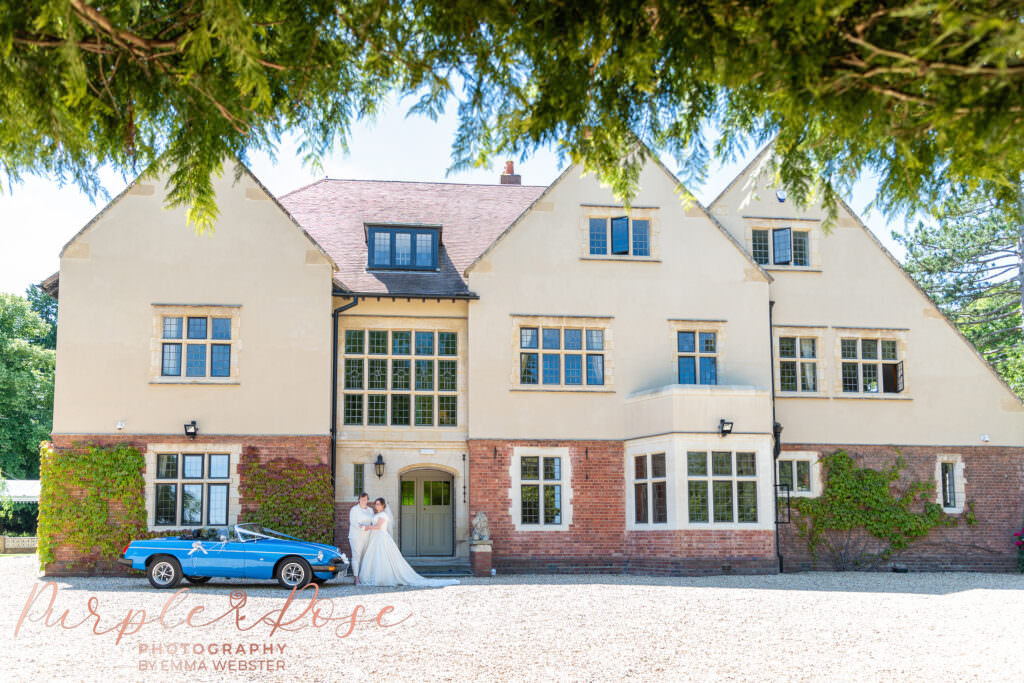 Brides in front of their wedding venue Plum Park in Towcester