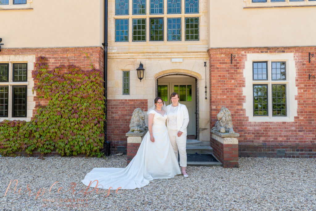 Brides stood in front of venue door