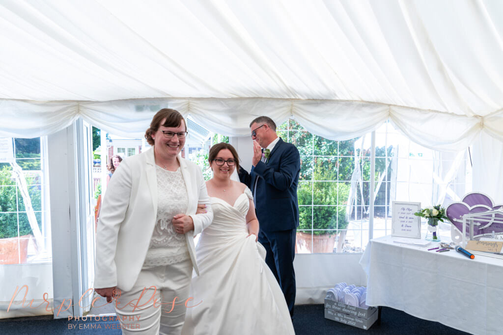 Brides entering the wedding reception