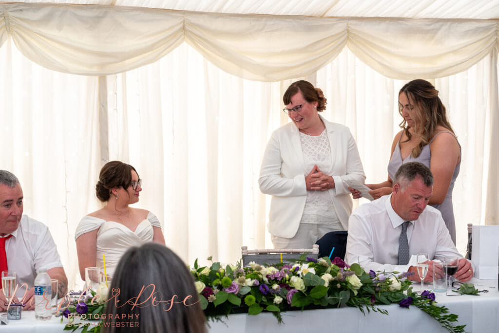 Bride giving a speech at her wedding