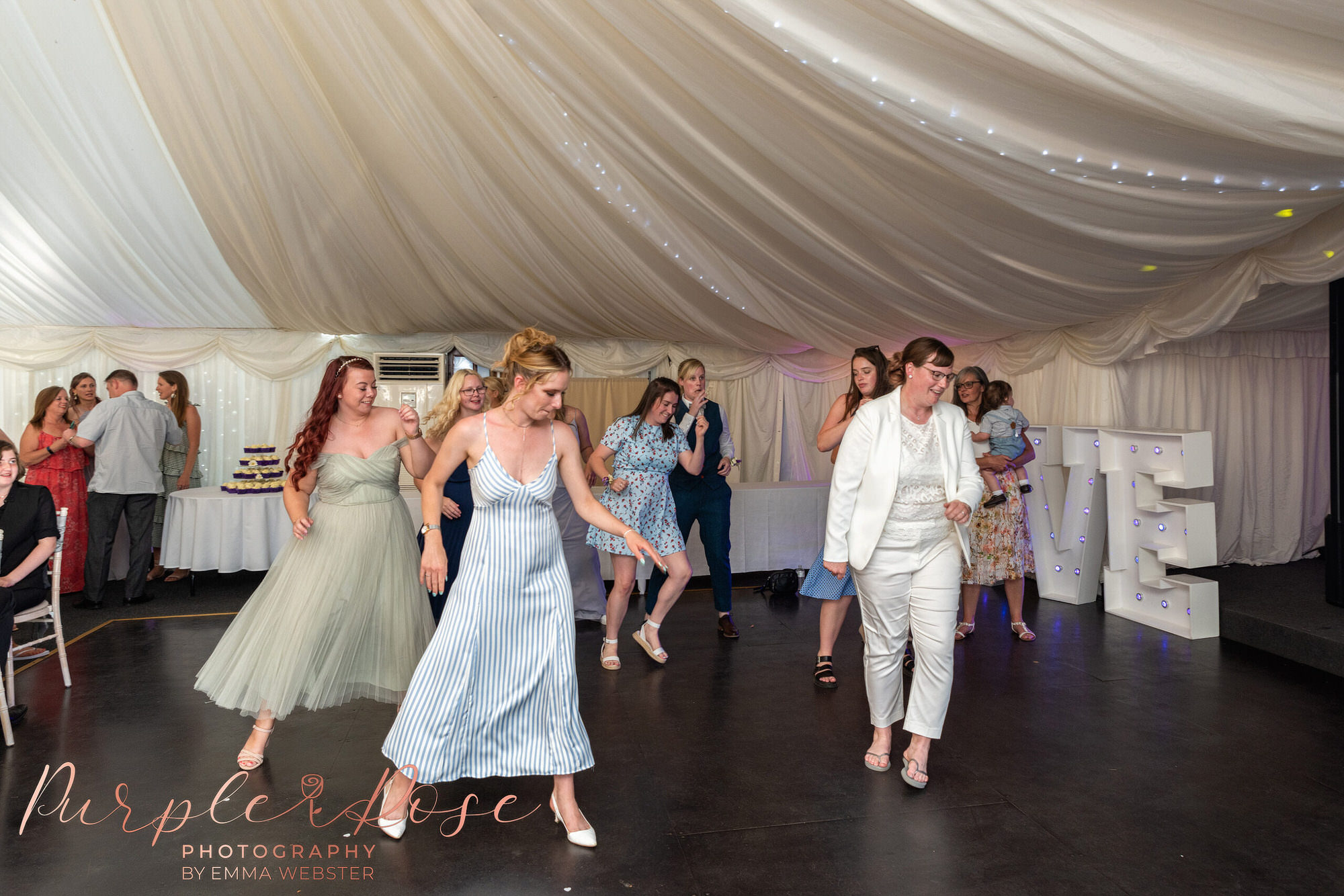 Bride dancing with her wedding guests
