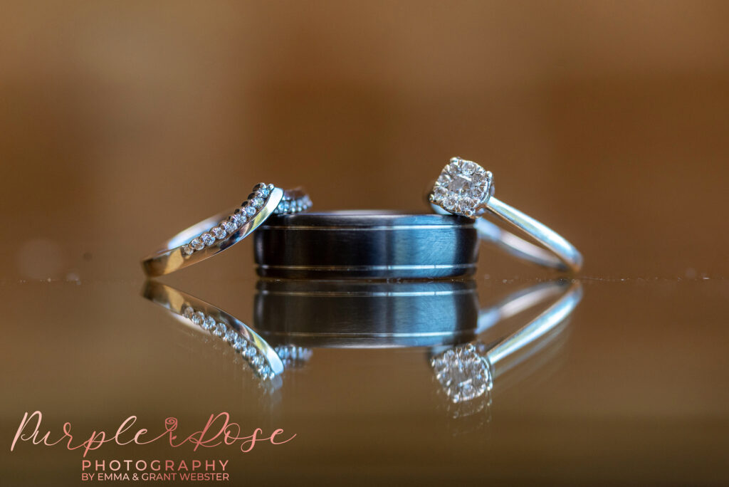 Close up photo of a couples wedding rings on their wedding day in Northampton