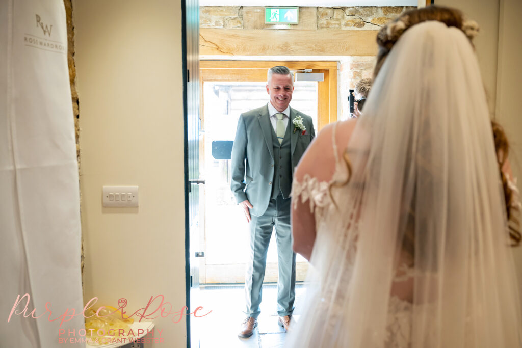 fathers emotional reaction as he see's his daughter in her wedding dress for the first time