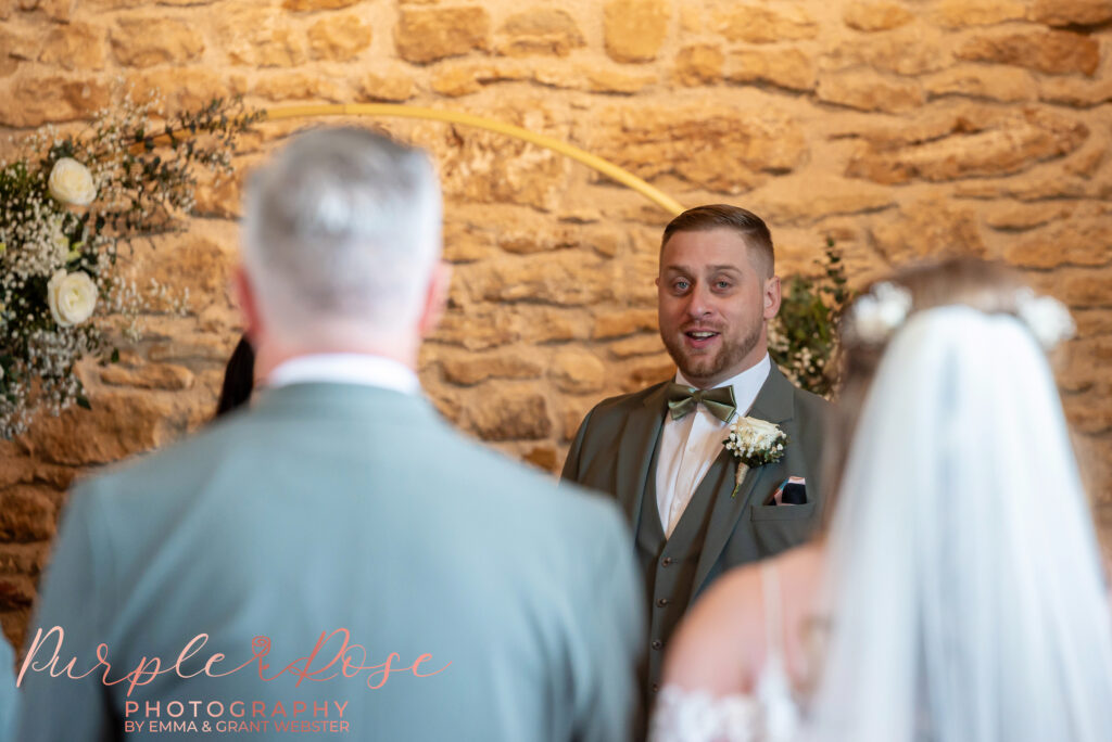 Grooms emotional reaction when he see's his bride on their wedding day at Dodford Manor