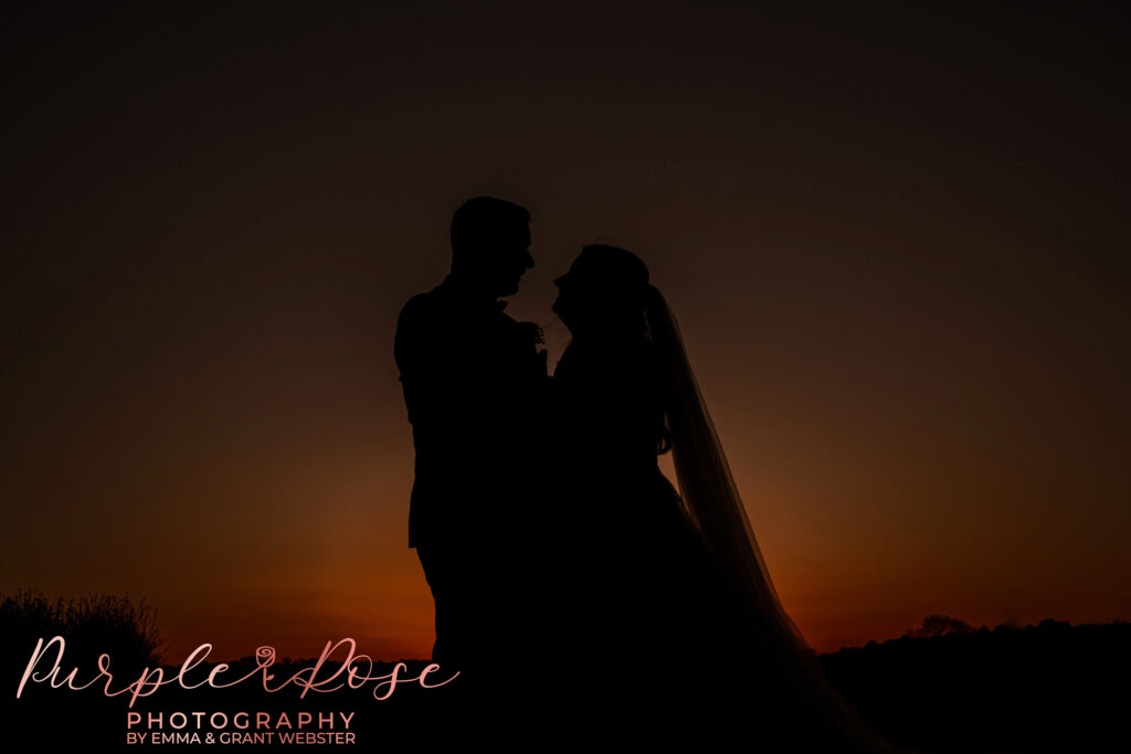 Silhouette of a bride and groom taken at Dodford Manor in Northampton