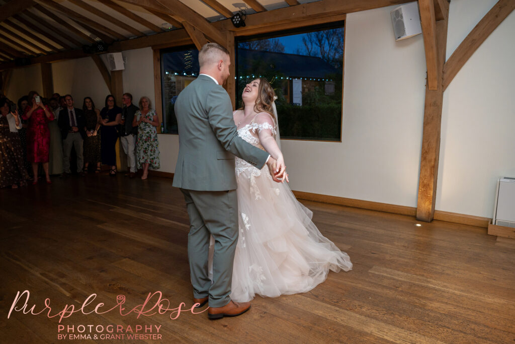 Bride and groom enjoying their first dance at Dodford Manor in Northampton