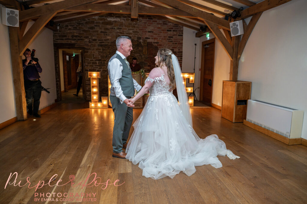 Bride and father dancing together at a wedding day in Dodford Manor, Northampton