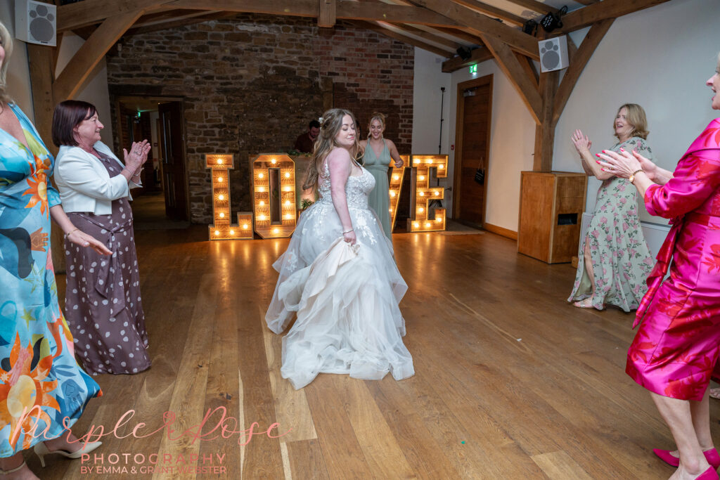 Bride dancing on her wedding day at Dodford Manor in Northampton