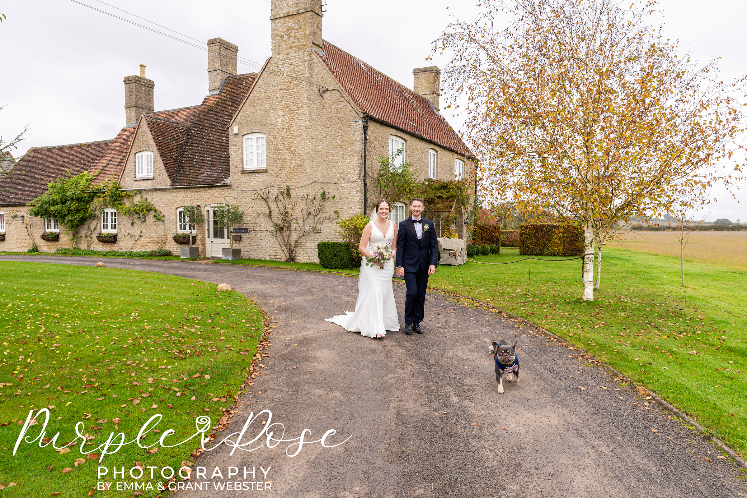 Bride and groom walking with their dog on their wedding day in Bicester