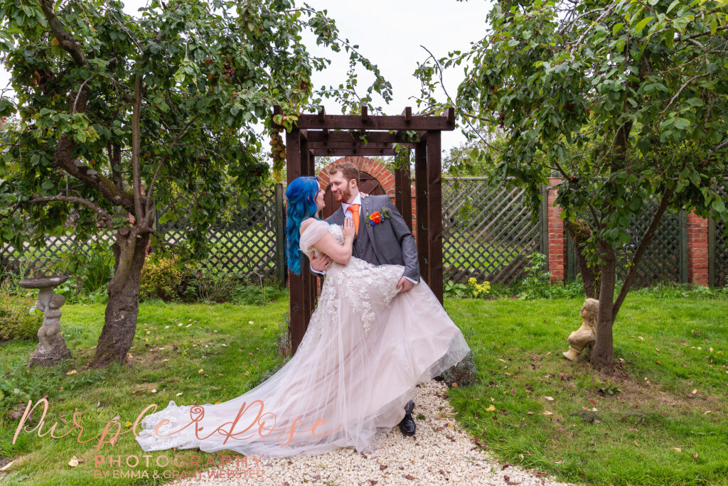 Photo of a bride and groom embracing on their wedding day in Milton Keynes