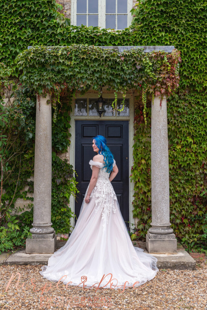 Photo showing the back of the brides wedding dress on her wedding day in Milton Keynes