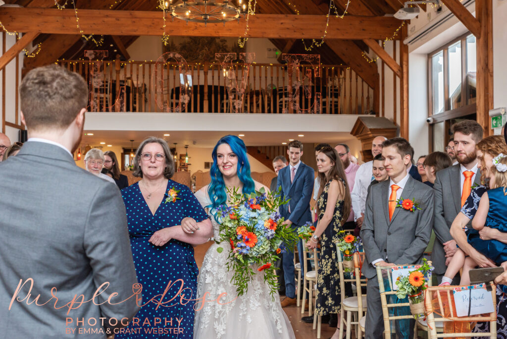 Photo of bride smiling as she sees her groom for the first time on their wedding day in Milton Keynes