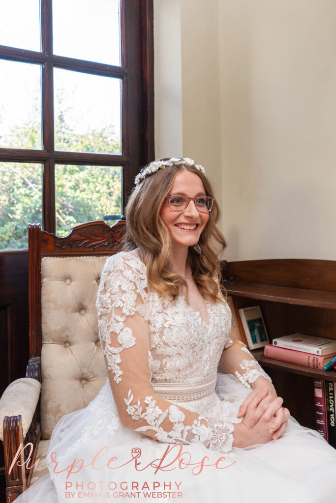 Photo of a bride sat in a chair on her wedding day in Milton Keynes