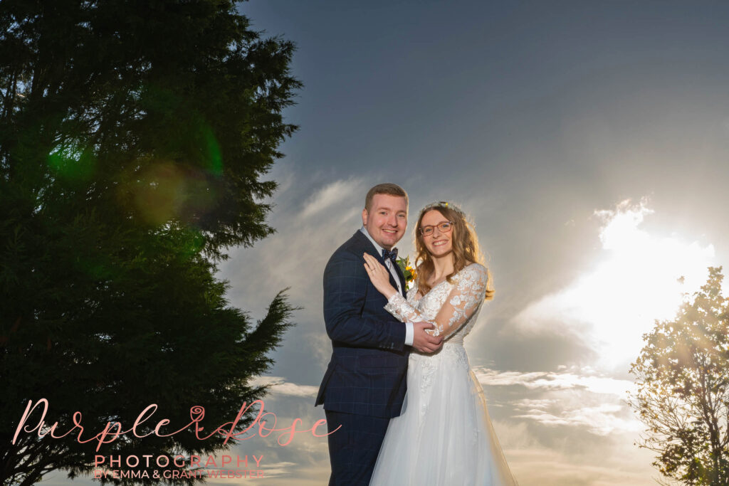 Photo of a bride and groom on a sunny day at their wedding in Milton Keynes