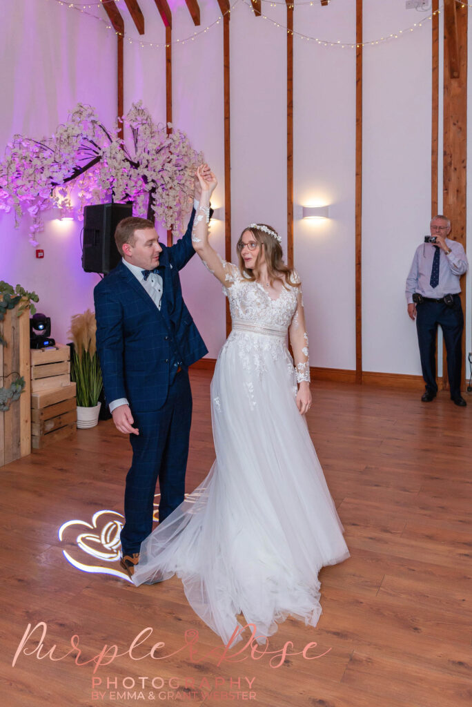 Photo of bride and groom enjoying their first dance on their wedding day in Milton Keynes