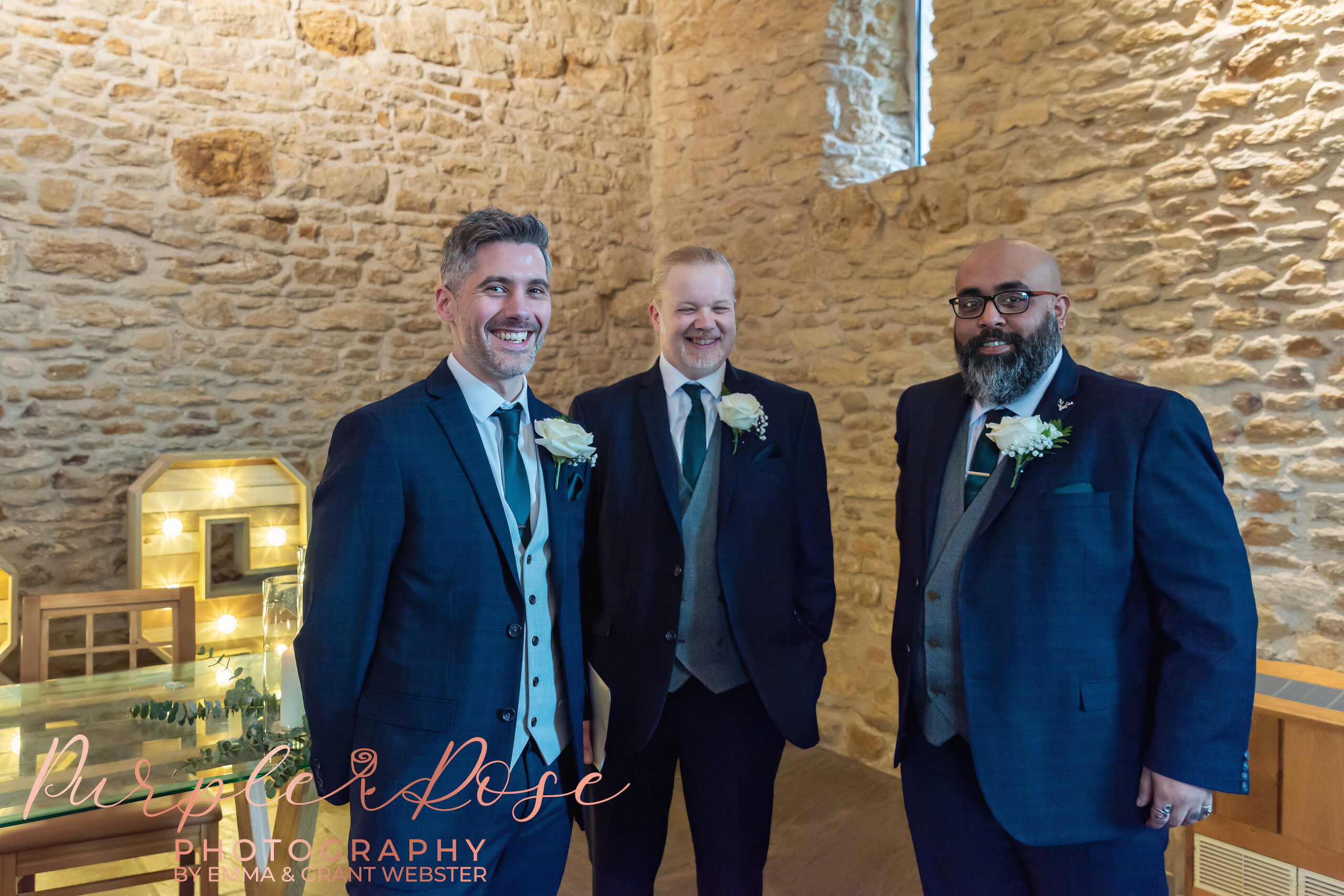 Photo of a groom laughing with his groomsmen as he waits for his wedding cermeony to begin in Milton Keynes