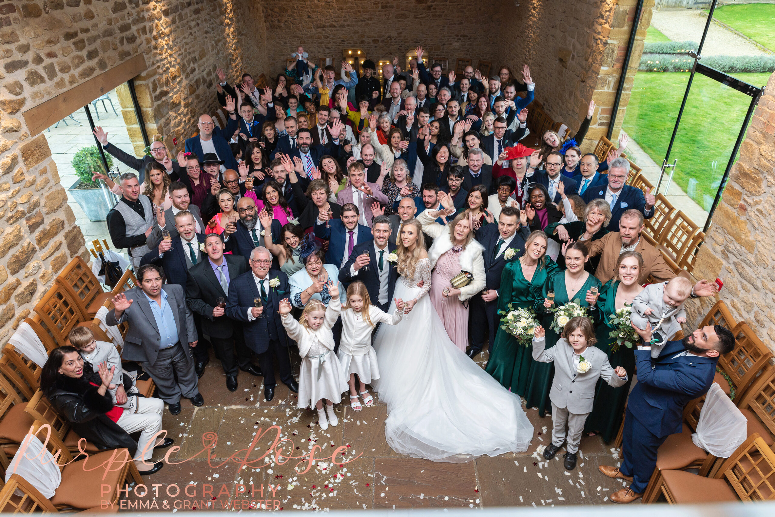 Arieal photo of bride and groom with all their weding guests at a wedding in MIlton Keynes