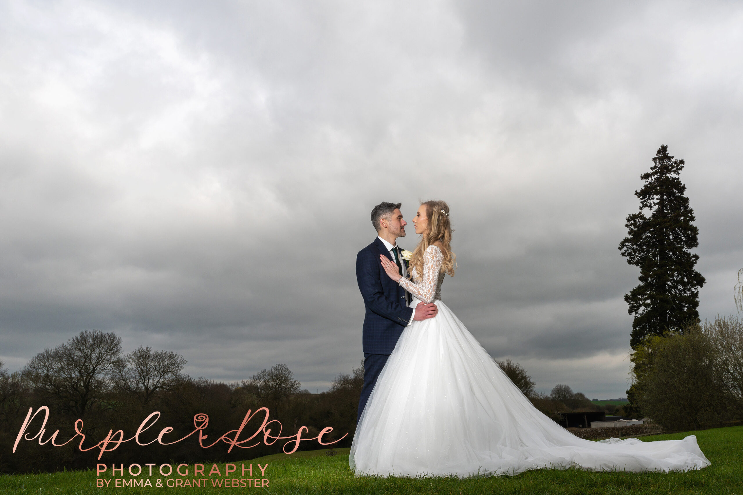 Photo of bride and groom looking into each others eyes on a stormy day in milton Keynes