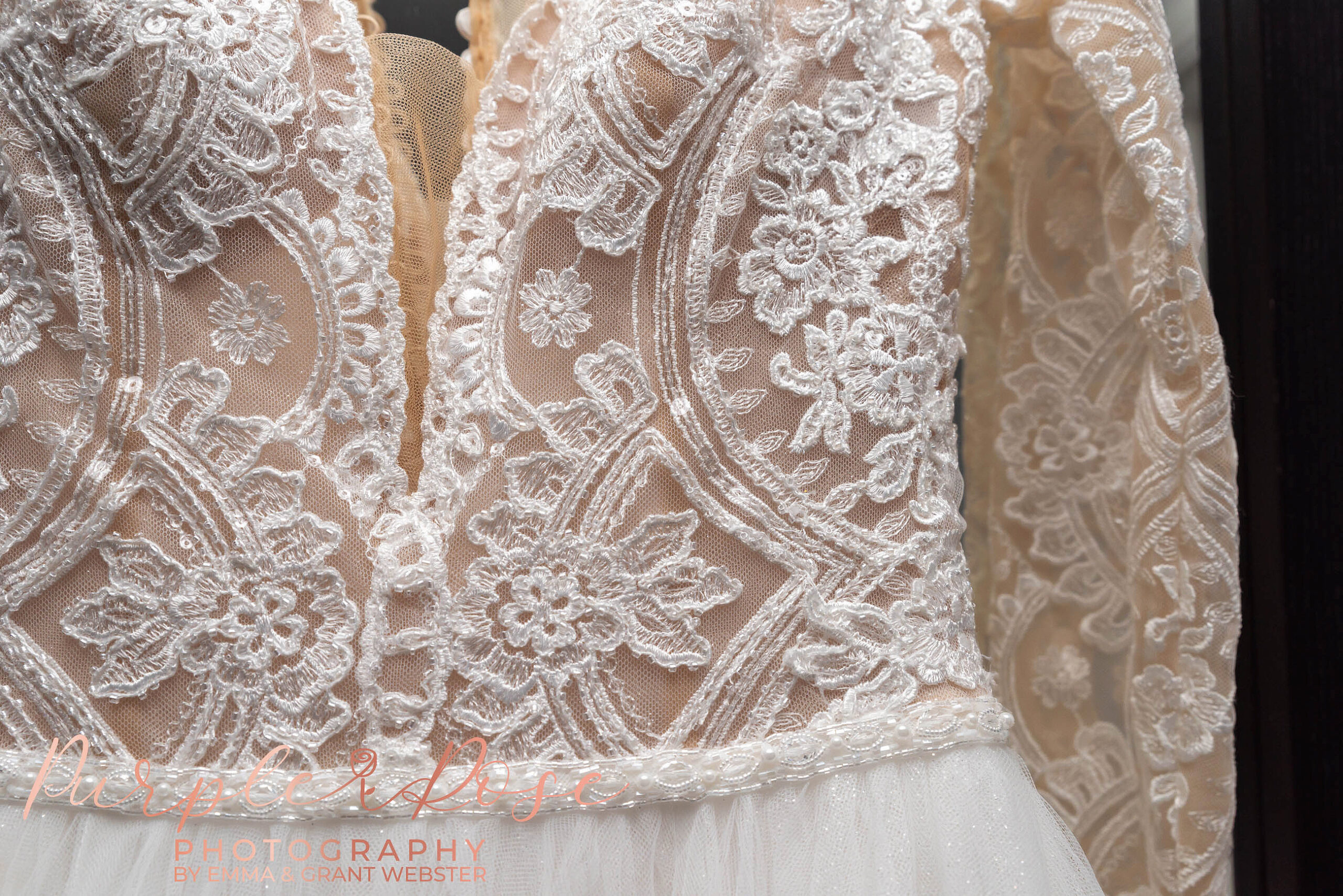 Photo of the lace detail of a brides wedding dress in Milton Keynes