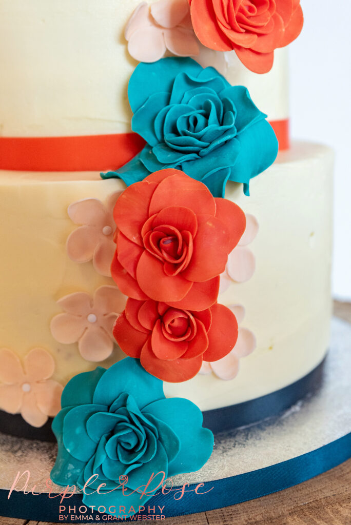 Close up photo of flowers on a wedding cake in Buckinghamshire