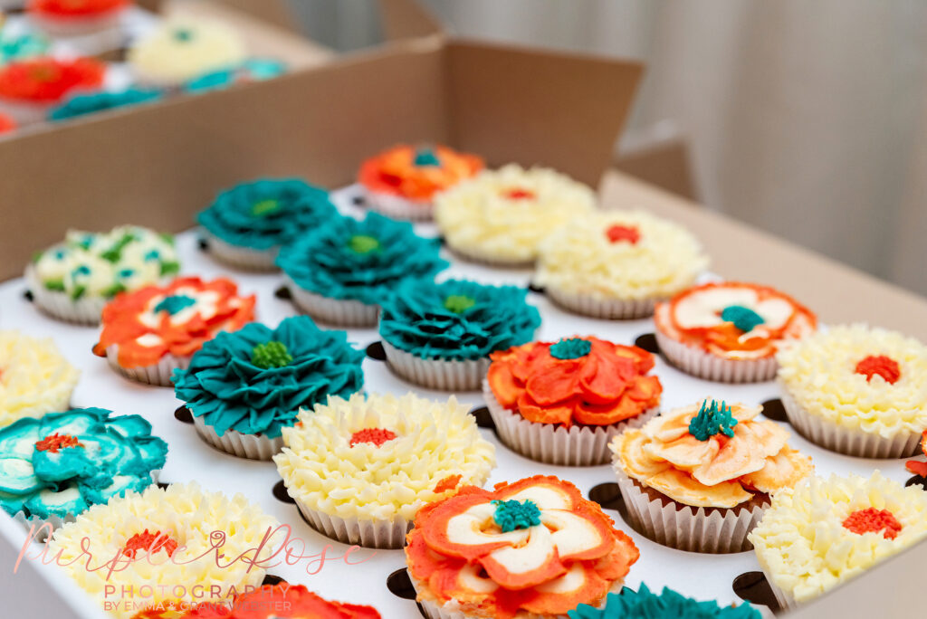 Photo of intricate flower design cup cakes at a wedding in Milton Keynes