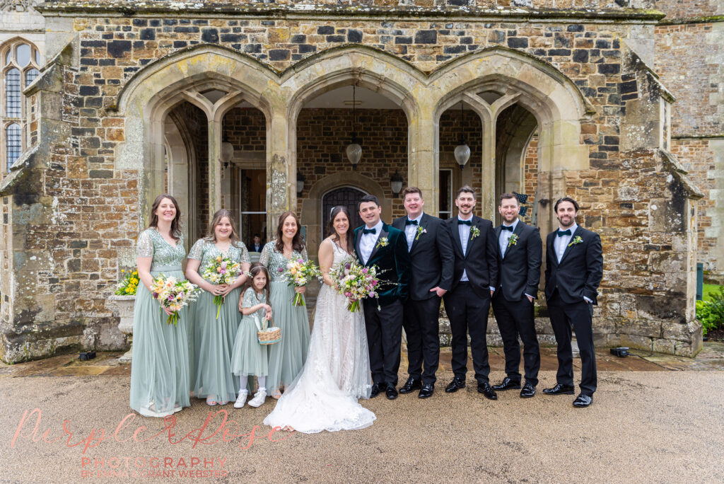 Group photo of bride and groom and their bridal party at a wedding in Northampton