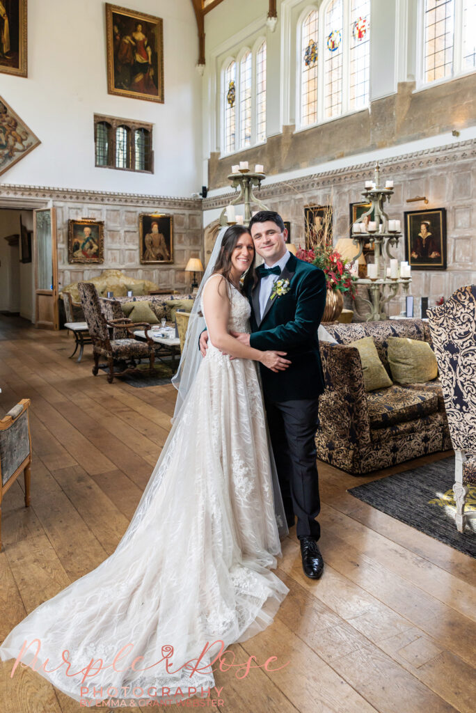 Photo of a bride and groom in the Tudor Great Hall at Fawsley Hall in Northampton