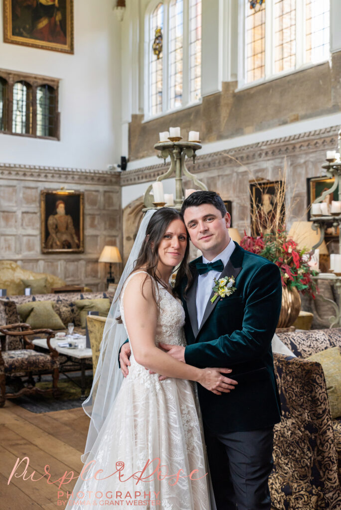 Photo of a bride and groom in the Tudor Great Hall at Fawsley Hall in Northampton