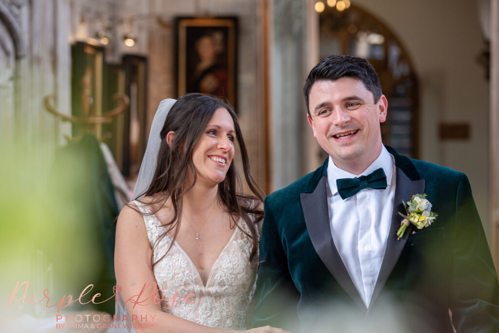 Photo of a bride and groom in the Tudor Great Hall at Fawsley Hall in Northampton