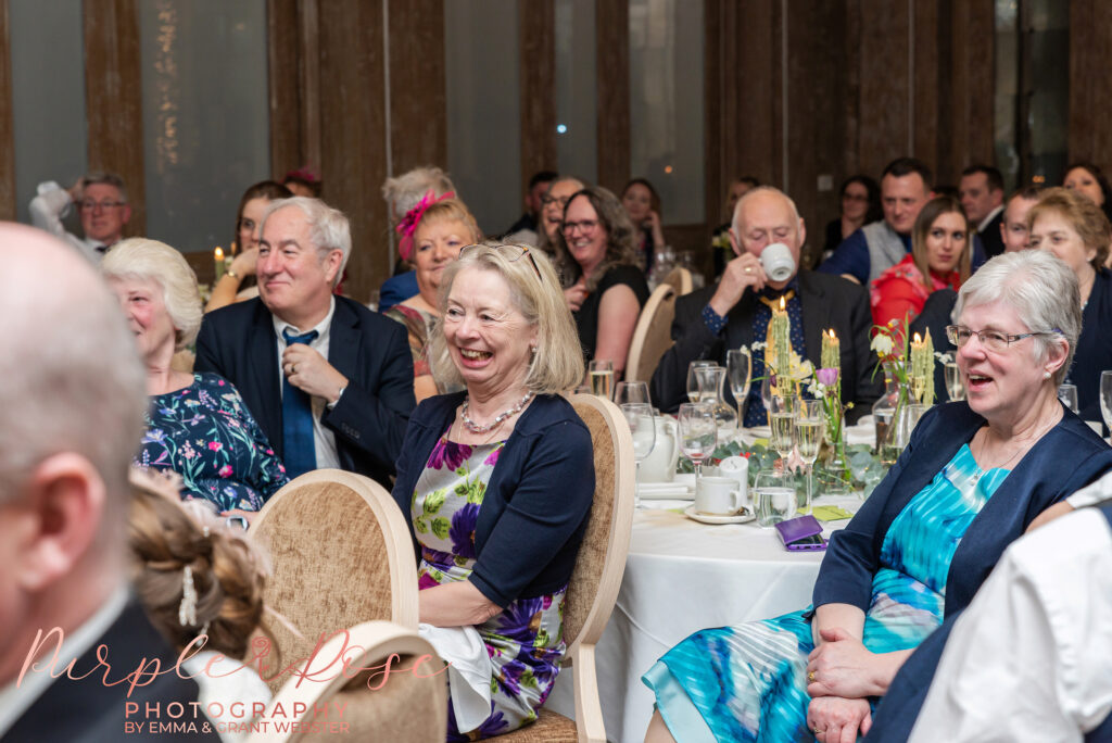 Photo of a guest laughing at a wedding Northampton