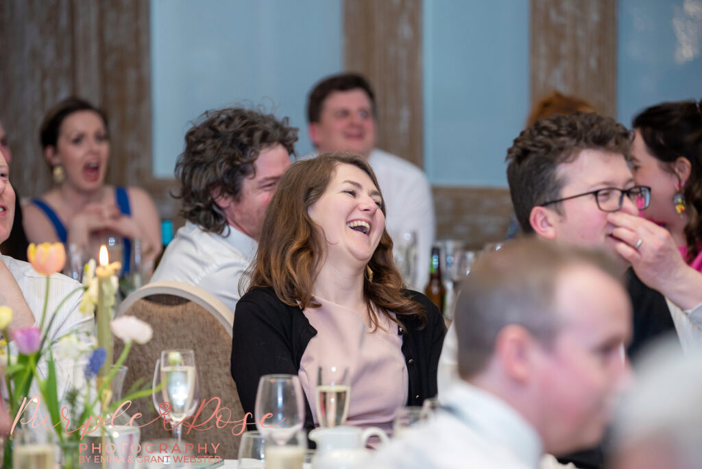 Photo of a guest laughing at a wedding Northampton