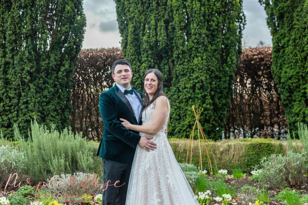 Photo of a bride and groom in the gardens of their wedding venue in Northampton