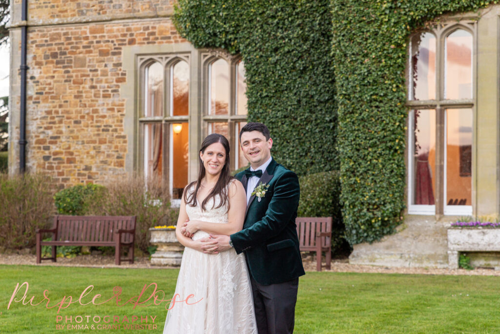 Photo of a bride and groom outside their wedding venue in Northampton