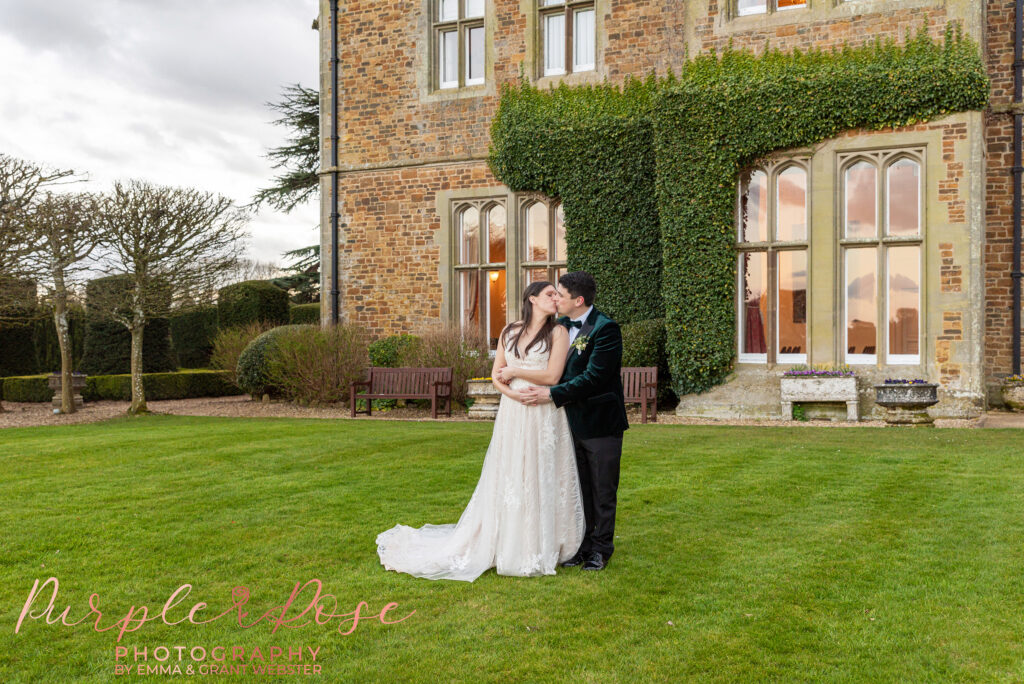 Photo of a bride and groom outside their wedding venue in Northampton