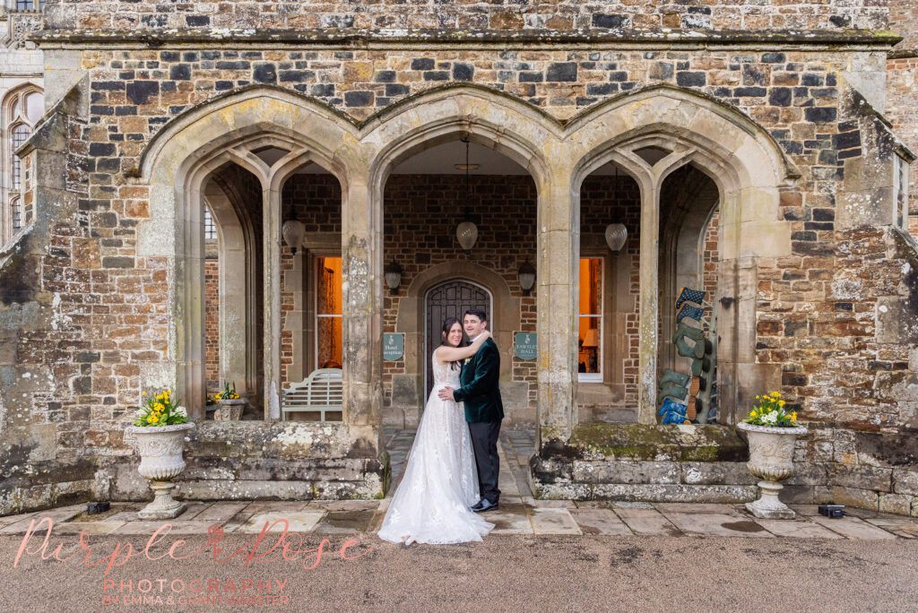 Photo of a bride and groom outside their wedding venue in Northampton