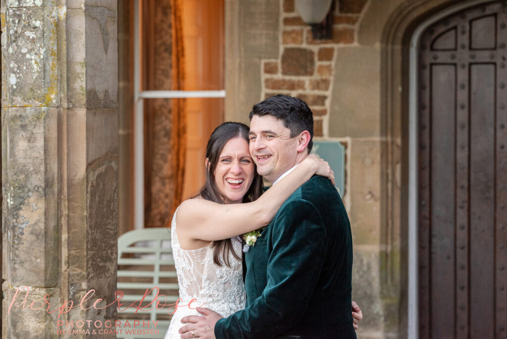 Photo of a bride and groom outside their wedding venue in Northampton