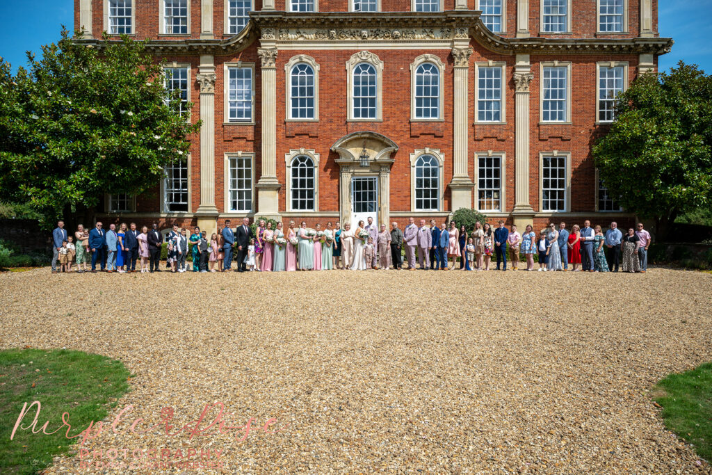 Group photo of the entire wedding party at a wedding at Chicheley Hall in Milton Keynes