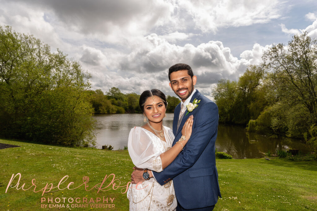 Photo of a bride and groom at a Lake after their wedding ceremony at Milton Keynes Registry Office