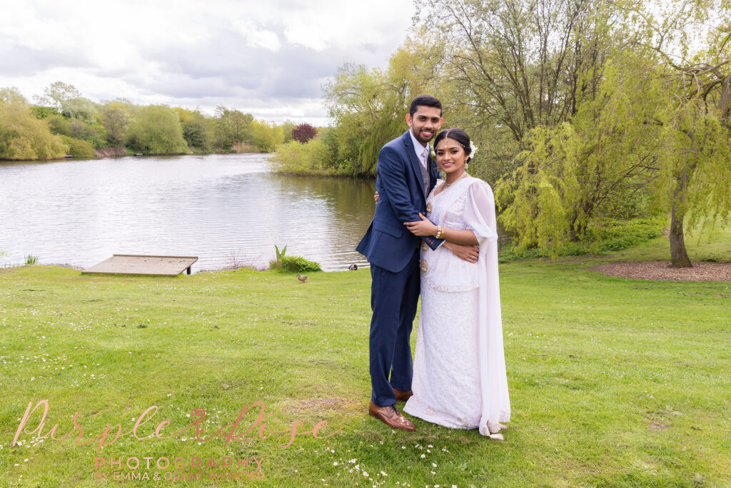 Photo of a bride and groom at a Lake after their wedding ceremony at Milton Keyne