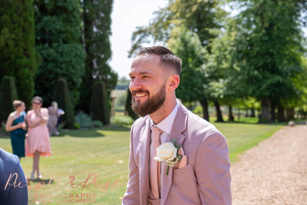 Groom smiling on his wedding day at Chicheley Hall in Milton Keynes