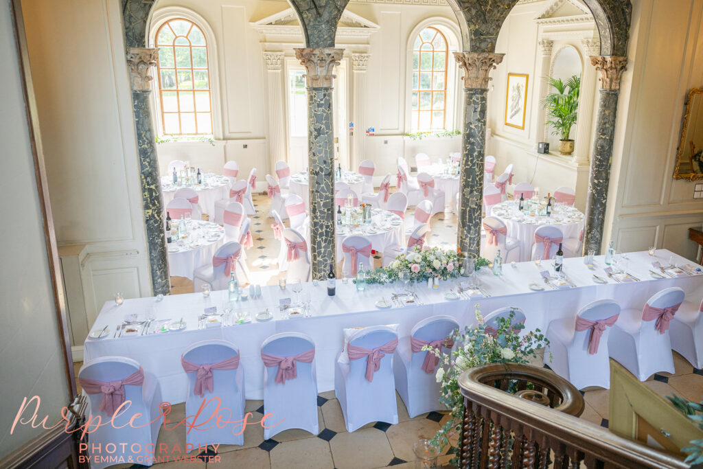 Photo of the reception room set up with a blush pink theme at Chicheley Hall in Milton Keynes