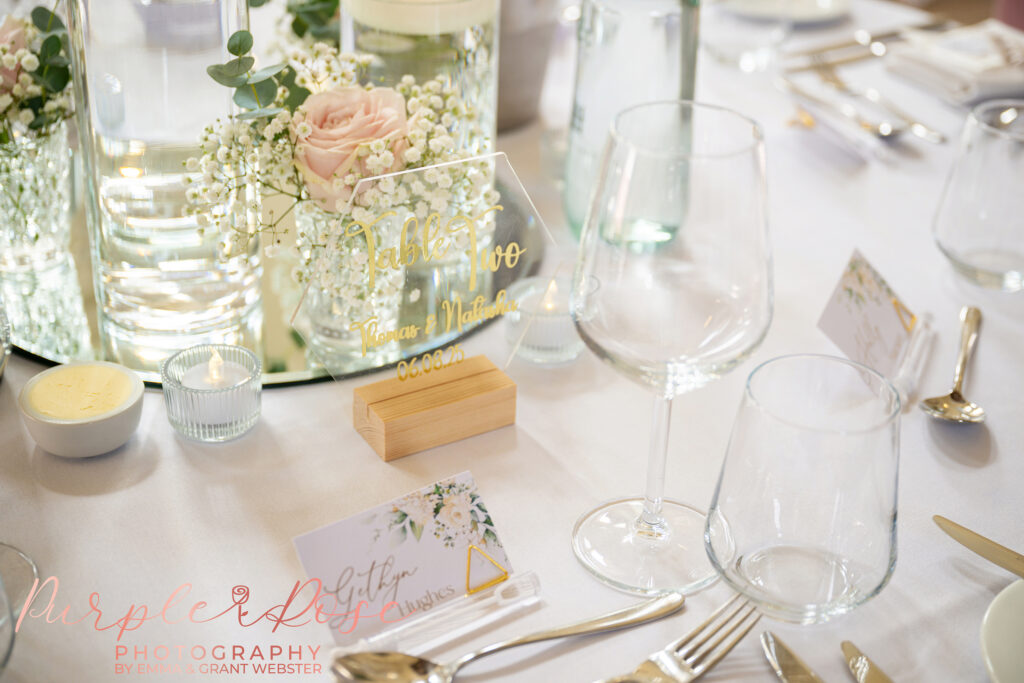 Close up details of the wedding breakfast table setting at a wedding at Chicheley Hall in Milton Keynes
