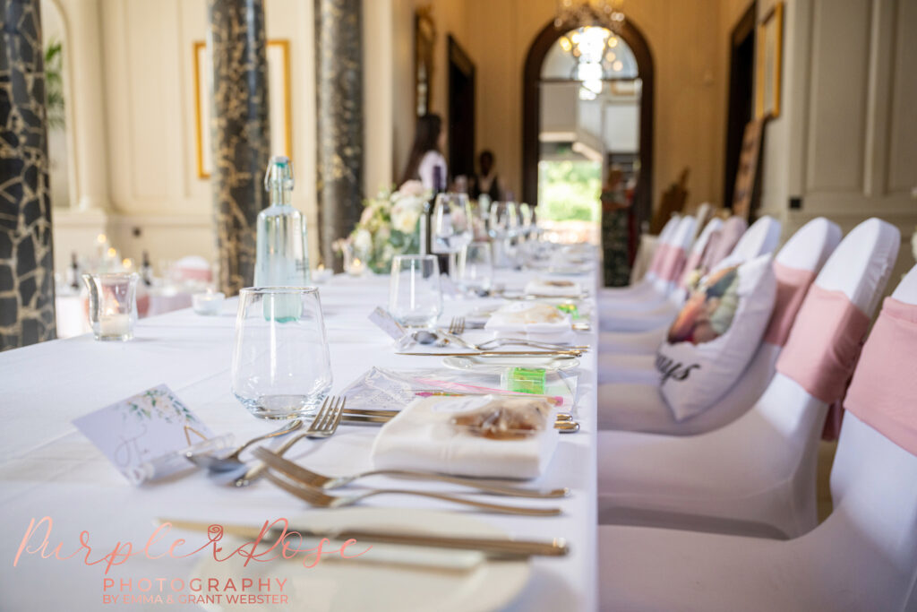 Photo of the head table set ready for the wedding breakfast at Chicheley Hall in Milton Keynes